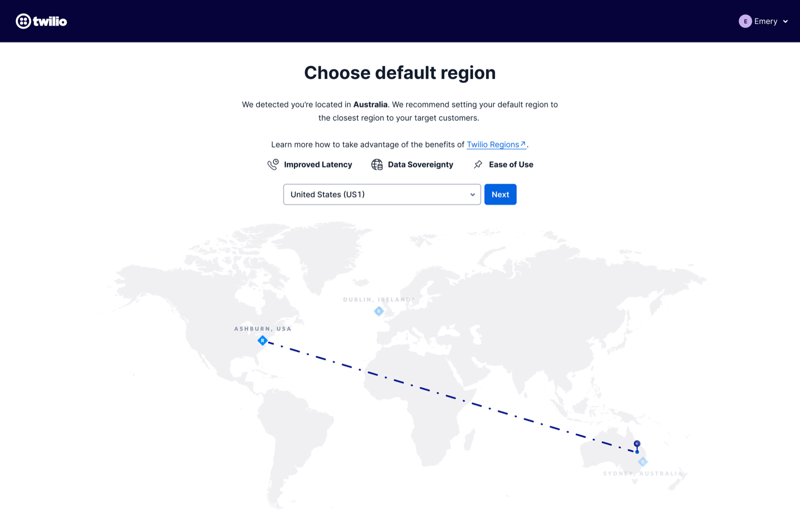Twilio's region onboarding screen — “Choose default region” with a world map routing from Ashburn to Sydney and a region dropdown defaulted to United States (US1)